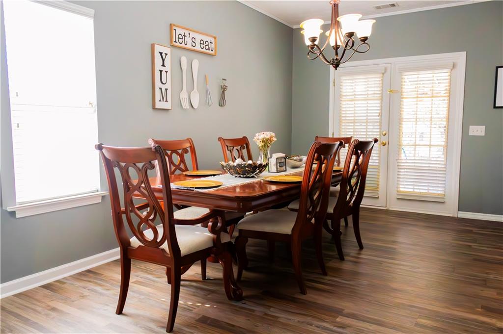 50 Berkeley Place Cartersville, GA 30121 - Photo 8 of 54 a view of a dining room with furniture window and wooden floor