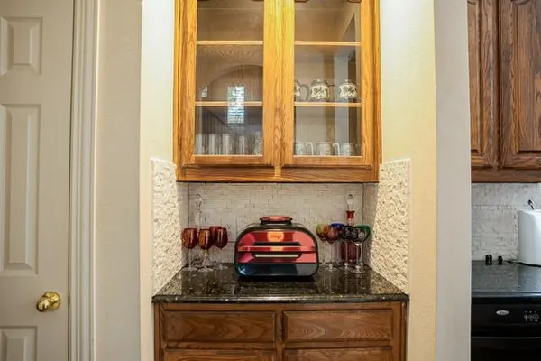 a kitchen with a stove and a cabinet