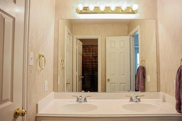 a bathroom with a sink and a mirror