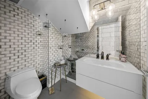 a bathroom with a bathtub and window