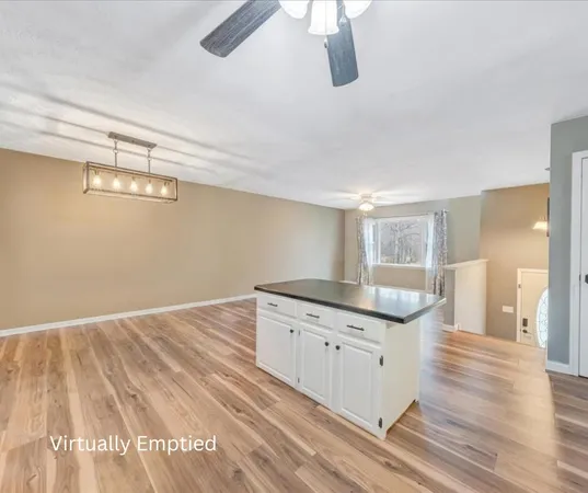 a kitchen with granite countertop a sink and a stove top oven