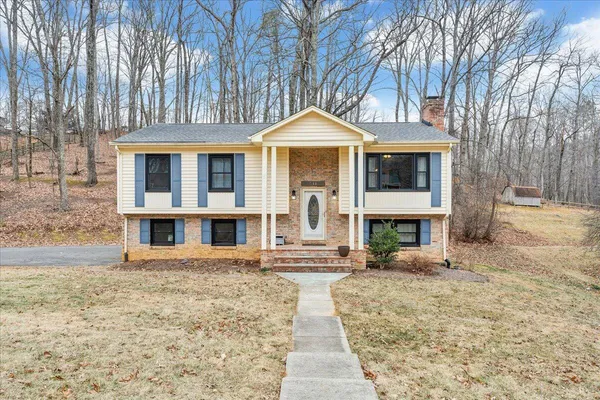 a front view of a house with a yard