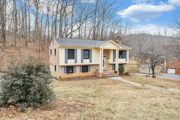 a front view of a house with a yard