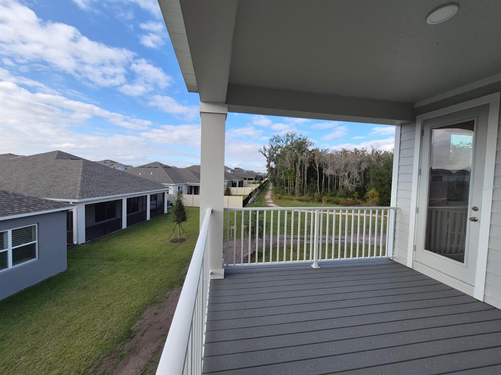 5197 Prairie Preserve Run St. Cloud, FL 34772 - Photo 38 of 39 a view of a house with a yard