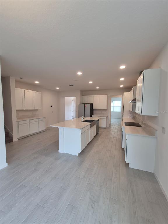 5197 Prairie Preserve Run St. Cloud, FL 34772 - Photo 5 of 39 a view of kitchen with kitchen island sink and center island