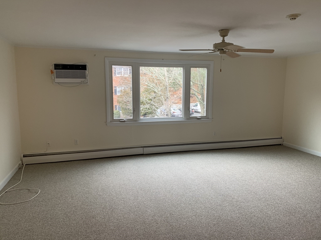23 Elm Street, Unit 1 Manchester, MA 01944 - Photo 4 of 8 an empty room with a window