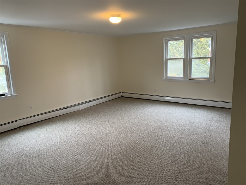 23 Elm Street, Unit 1 Manchester, MA 01944 - Photo 5 of 8 an empty room with a window