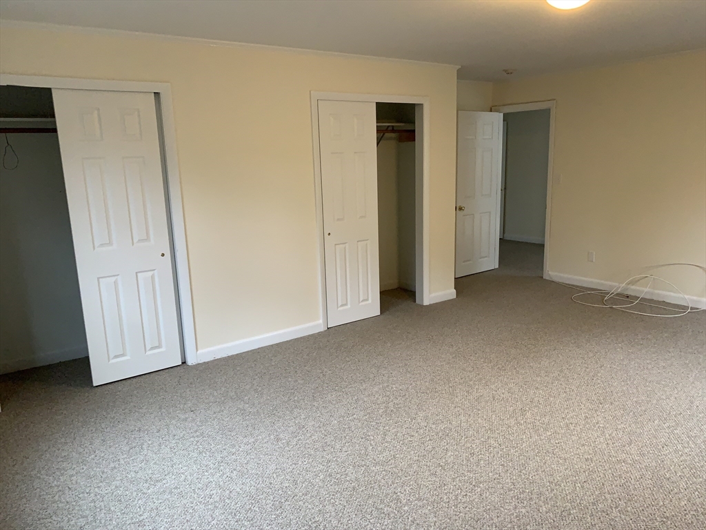 23 Elm Street, Unit 1 Manchester, MA 01944 - Photo 6 of 8 an empty room with window