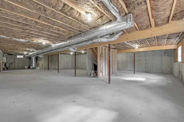 a bathroom with a granite countertop sink a toilet and a mirror