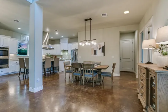a view of a dining area with furniture window and wooden floor