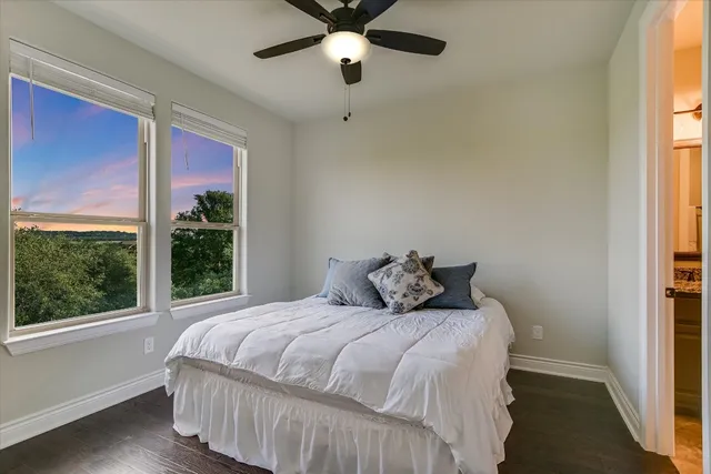 a bedroom with a large bed and a window