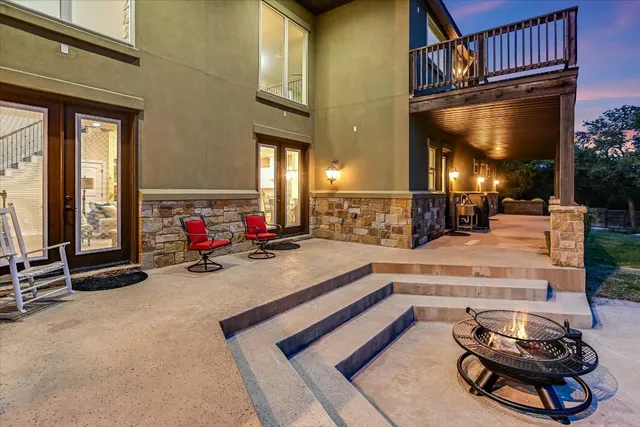 a gym with pool table and chairs