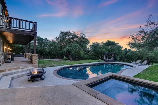 a view of a swimming pool with a patio