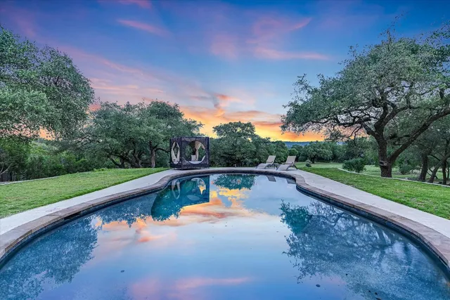 a view of swimming pool with a yard