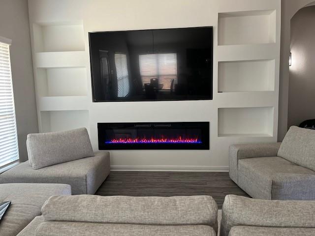 4013 Bravo Ranch Road Waco, TX 76705 - Photo 16 of 33 a living room with furniture and a fireplace