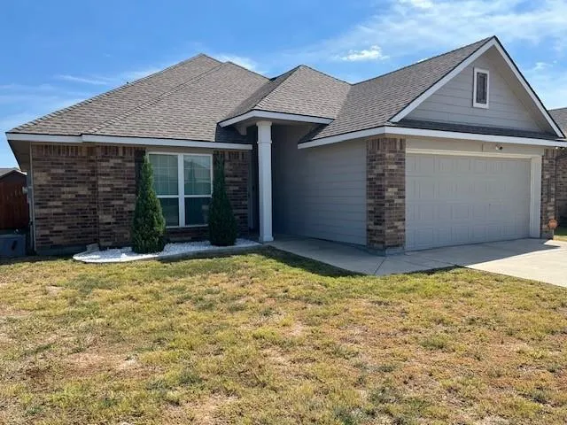 a house with yard in front of it