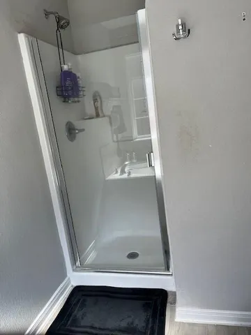 a kitchen with a sink and a refrigerator