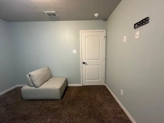 a bathroom with a granite countertop sink toilet and mirror