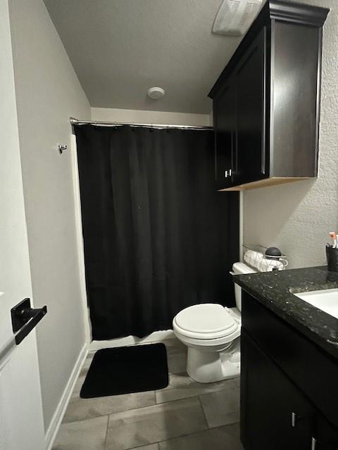 4013 Bravo Ranch Road Waco, TX 76705 - Photo 27 of 33 a bathroom with a granite countertop sink toilet and mirror