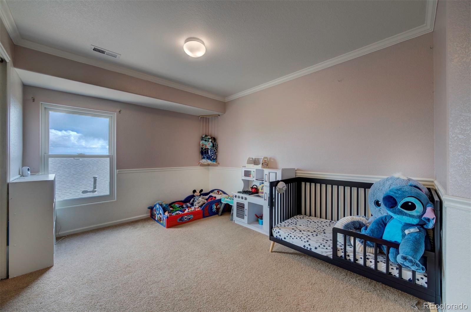 9364 Prairie Dunes Road Peyton, CO 80831 - Photo 13 of 18 a bedroom with furniture and a window