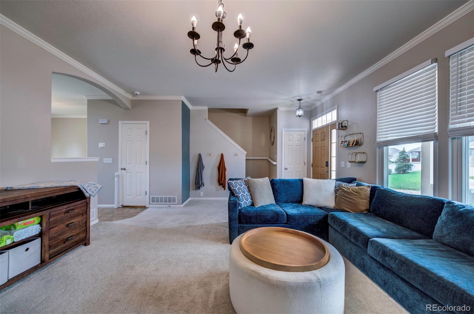9364 Prairie Dunes Road Peyton, CO 80831 - Photo 5 of 18 a living room with furniture and a large window