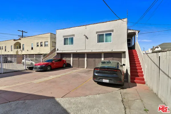 a view of a car parked in front of a building
