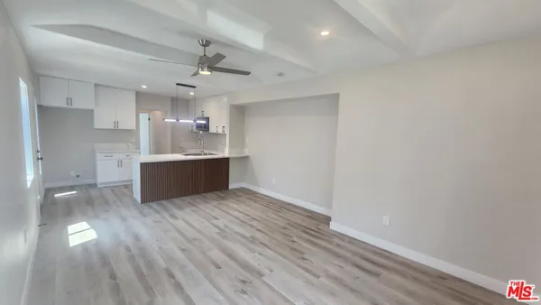 a view of a kitchen with a sink and a dishwasher
