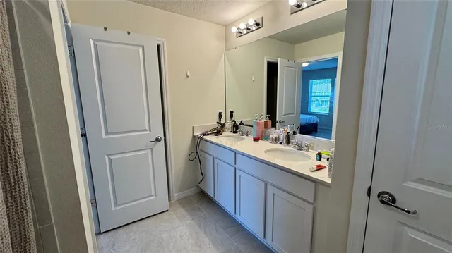a bathroom with a sink and a mirror