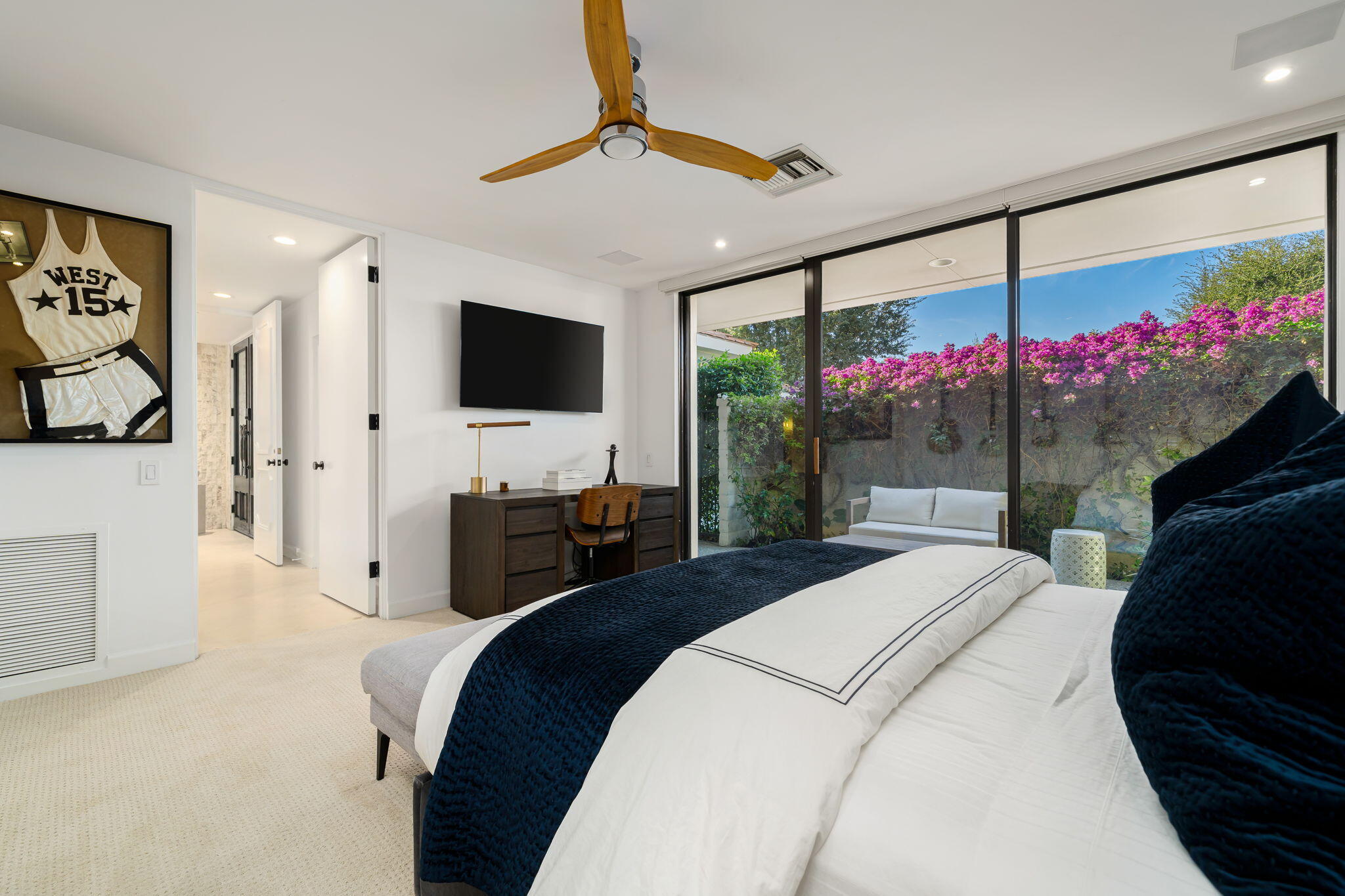 6 Exeter Court Rancho Mirage, CA 92270 - Photo 43 of 54 a bedroom with a bed and a flat screen tv