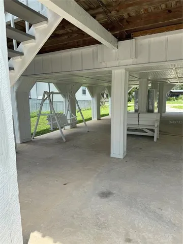a view of swimming pool with two windows