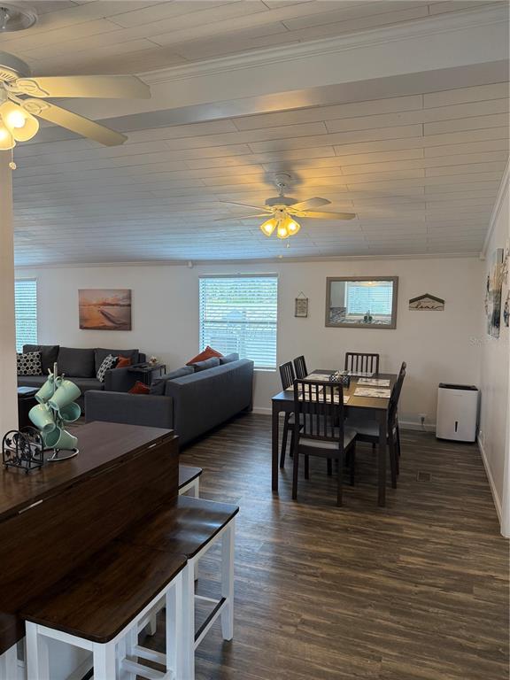 1712 Northeast King Street Steinhatchee, FL 32359 - Photo 5 of 18 a view of a dining room with furniture and wooden floor