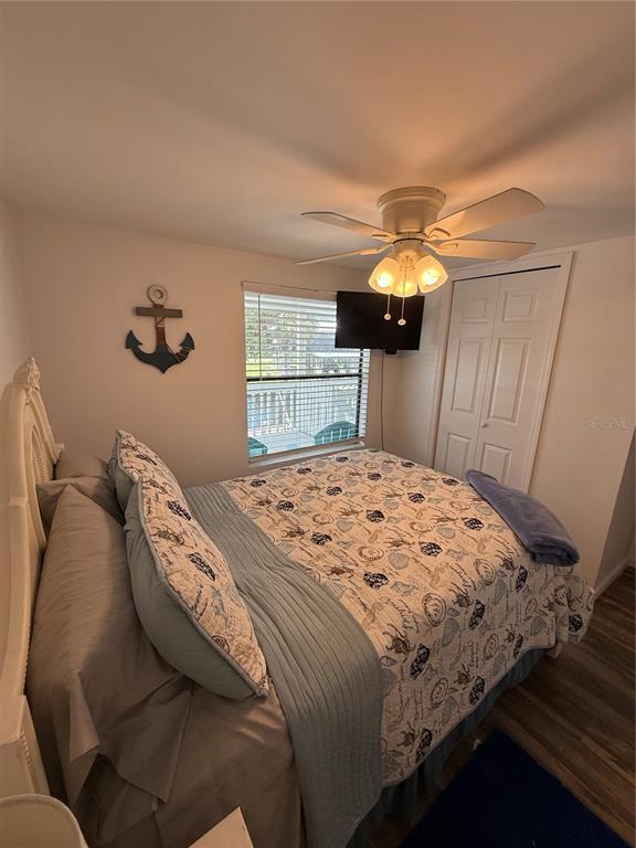 1712 Northeast King Street Steinhatchee, FL 32359 - Photo 9 of 18 a bedroom with a bed and a chandelier
