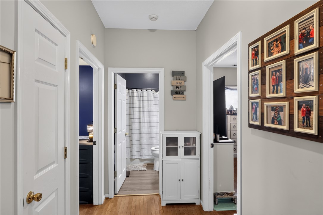 144 Elliott Circle Anderson, SC 29621 - Photo 30 of 30 Hardwood floors guide you through this inviting hallway, connecting a bathroom and another room, creating a seamless flow within the residence.