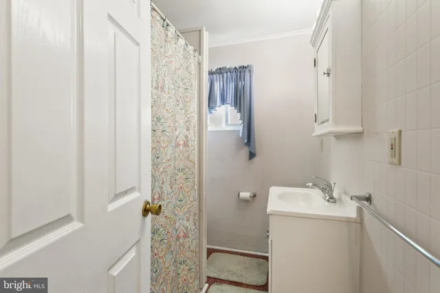 a bathroom with a shower and a sink