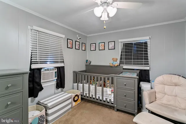 a bedroom with furniture and a chandelier