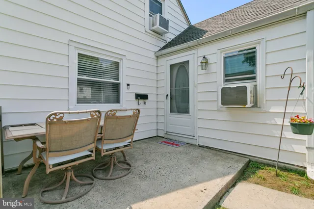 a view of a backyard with chair and tables