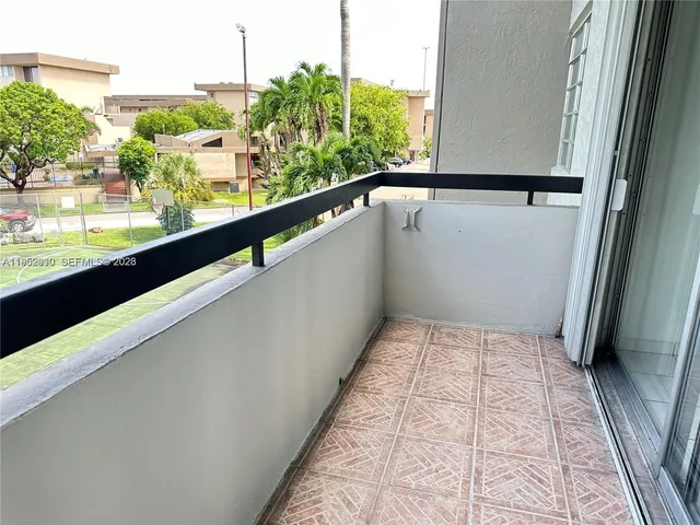 a view of a park with large trees