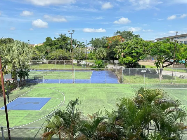 a view of a swimming pool with an outdoor space and seating area