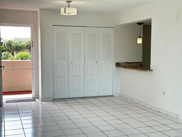 a view of a livingroom with an empty space and window