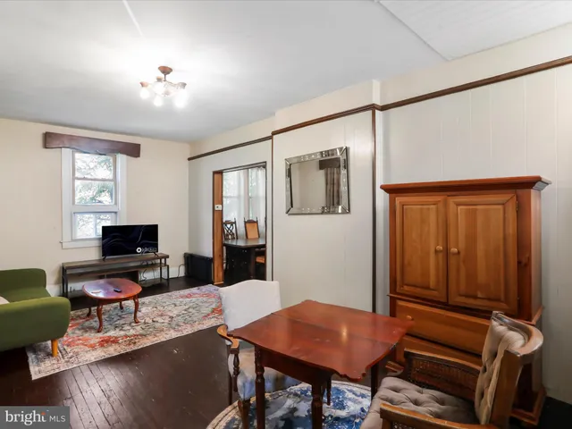 a workspace with furniture and wooden floor