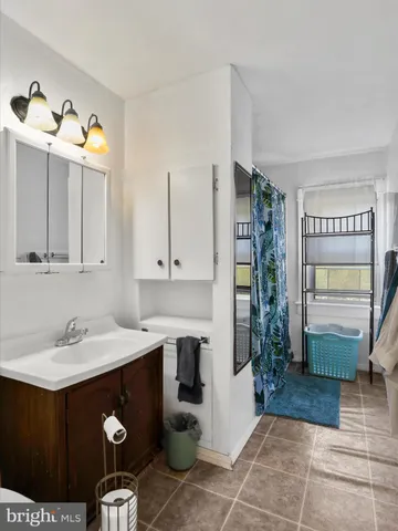 a kitchen with a sink and a refrigerator