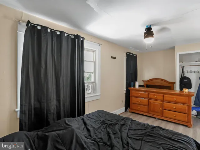 a bedroom with a bed and a closet