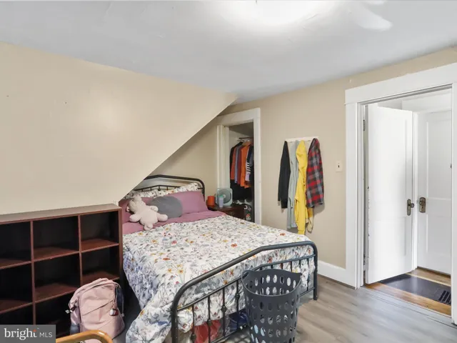 a bedroom with a bed and a closet