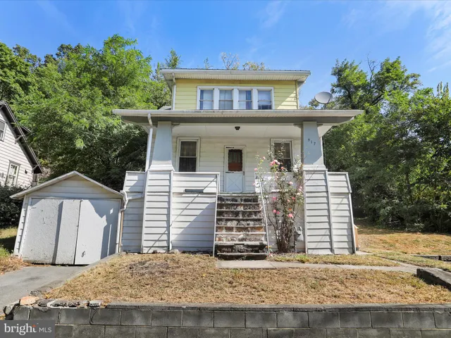 a front view of a house with garage