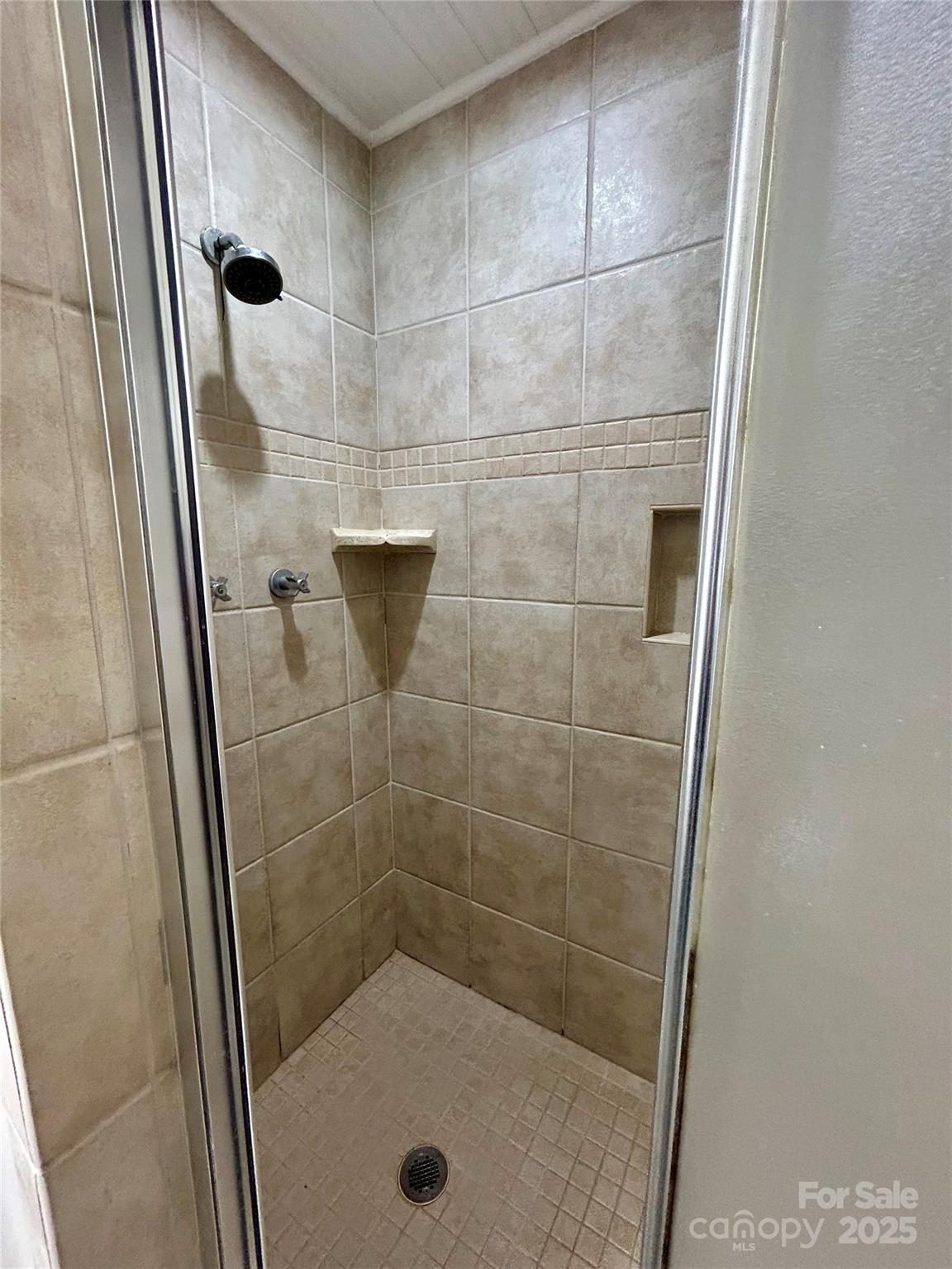 5734 Brookhaven Road Charlotte, NC 28210 - Photo 12 of 12 a bathroom with a glass door shower