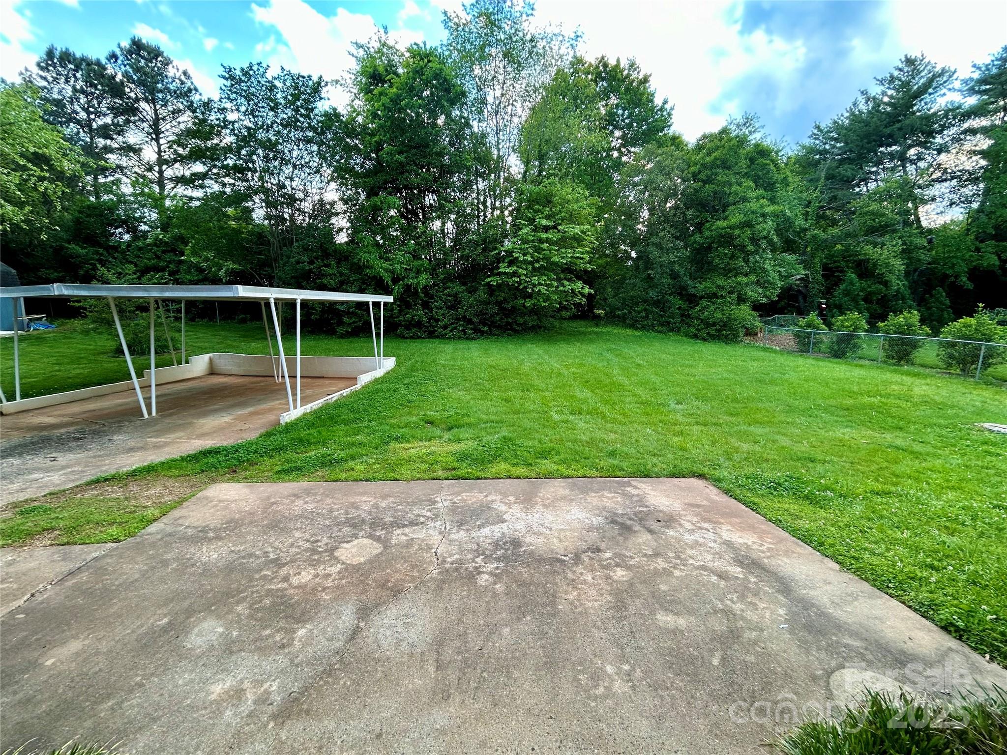 5734 Brookhaven Road Charlotte, NC 28210 - Photo 3 of 12 a view of a backyard with a park