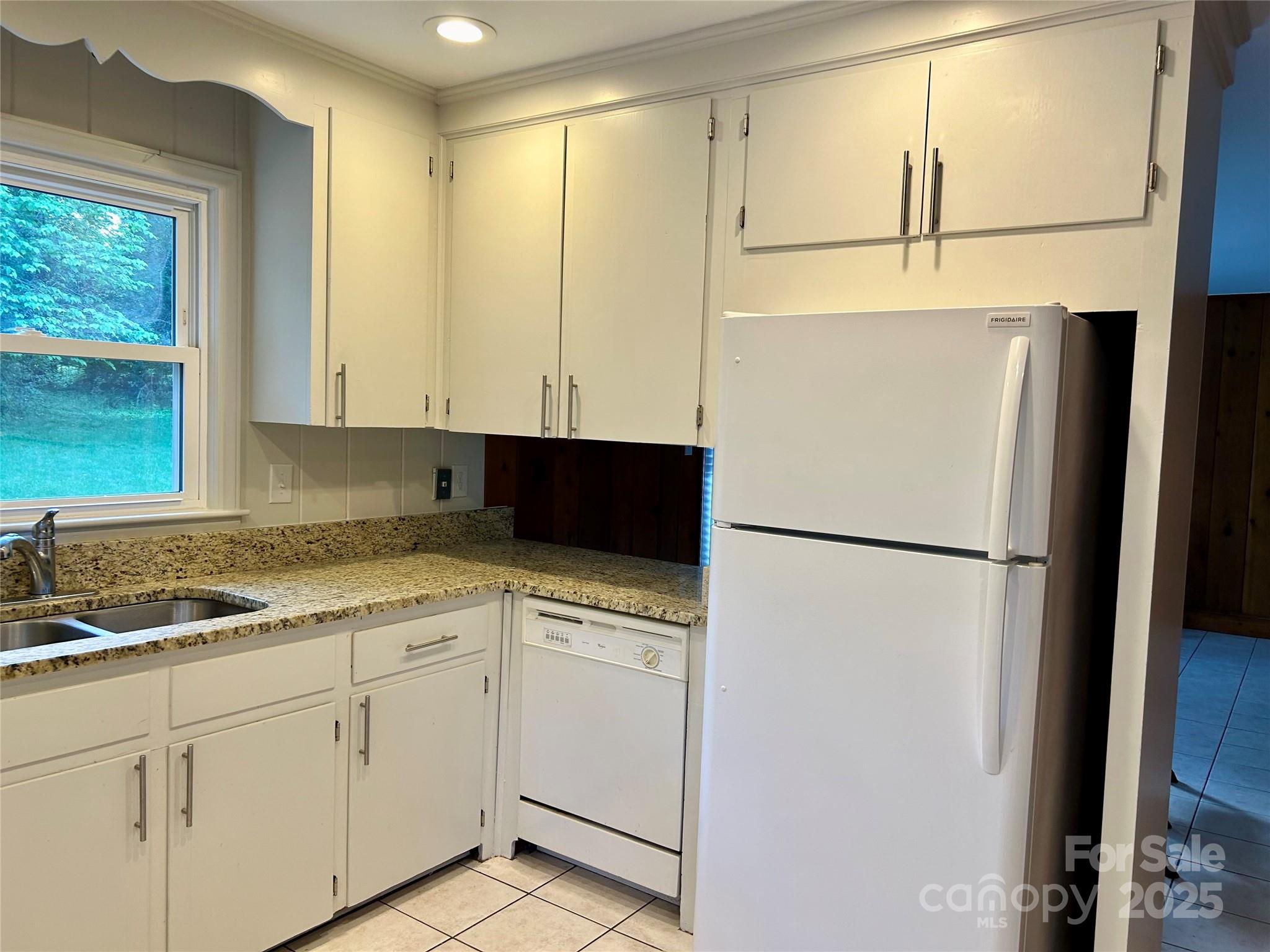 5734 Brookhaven Road Charlotte, NC 28210 - Photo 4 of 12 a white refrigerator freezer sitting in a kitchen