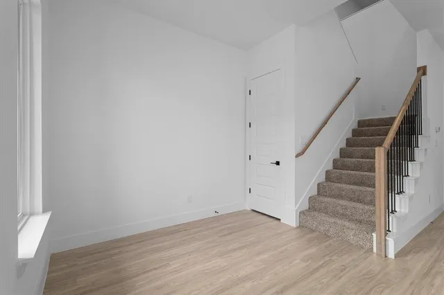 a view of entryway with wooden floor