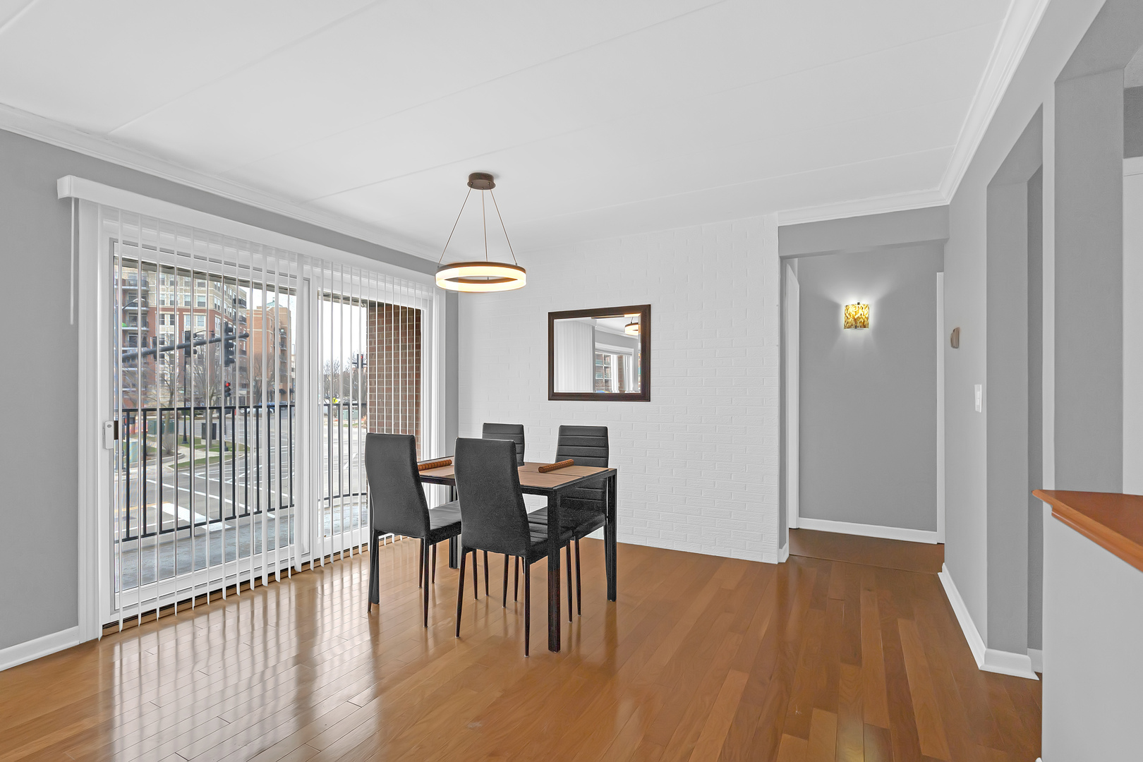 659 South Des Plaines River Road, Unit 2A Des Plaines, IL 60016 - Photo 11 of 28 a view of a dining room with furniture window and wooden floor