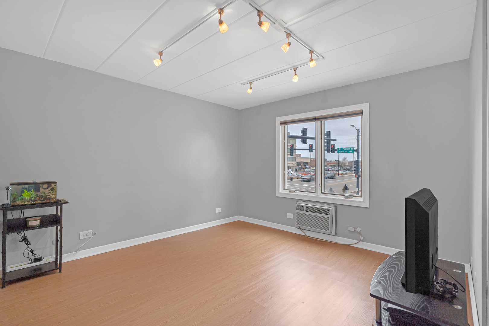 659 South Des Plaines River Road, Unit 2A Des Plaines, IL 60016 - Photo 19 of 28 a view of workspace with wooden floor and window